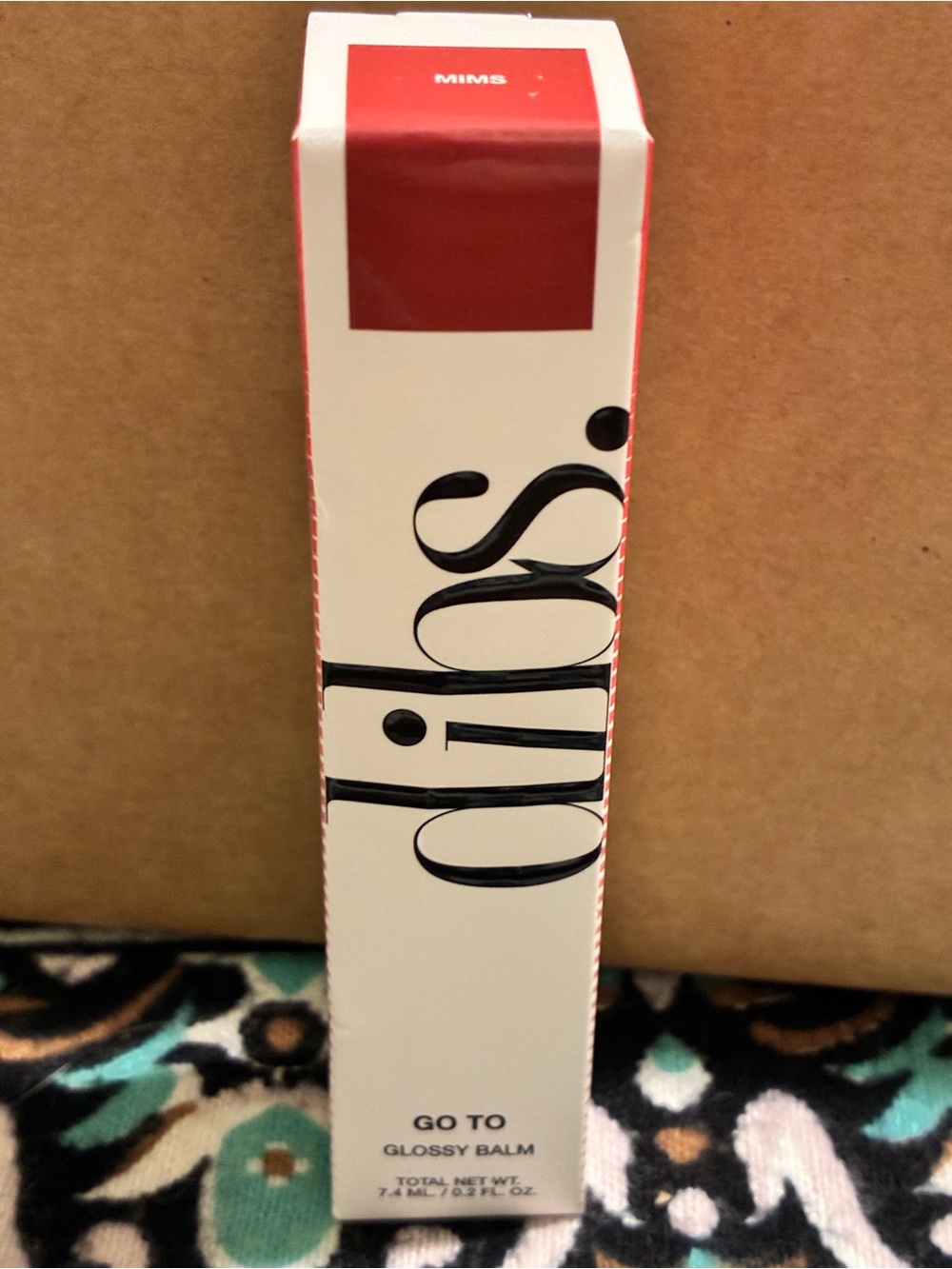 Dibs Go To Glossy Balm in shade mims